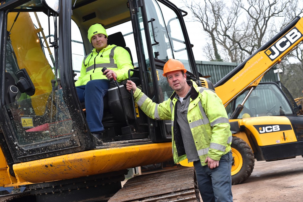 Frank Williamson (right) puts trainee operator Sye (correct) Robinson through his paces at the operator traning school