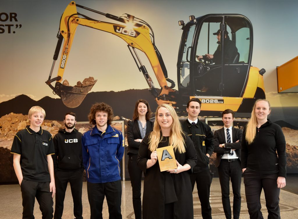 Pictured left to right are JCB young apprentices Sam Taylor, Callum Lowes, Daisy Coombes, Holly Broadhurst, Greg Lawson, Harry Tomlinson and Amy Harris at JCB Compact Products, Cheadle Brief.  Picture of Holly Broadhurst, who has won the Higher and Degree Apprentice of the Year at the National Apprenticeship Awards. The job is at Compact Products in Cheadle.