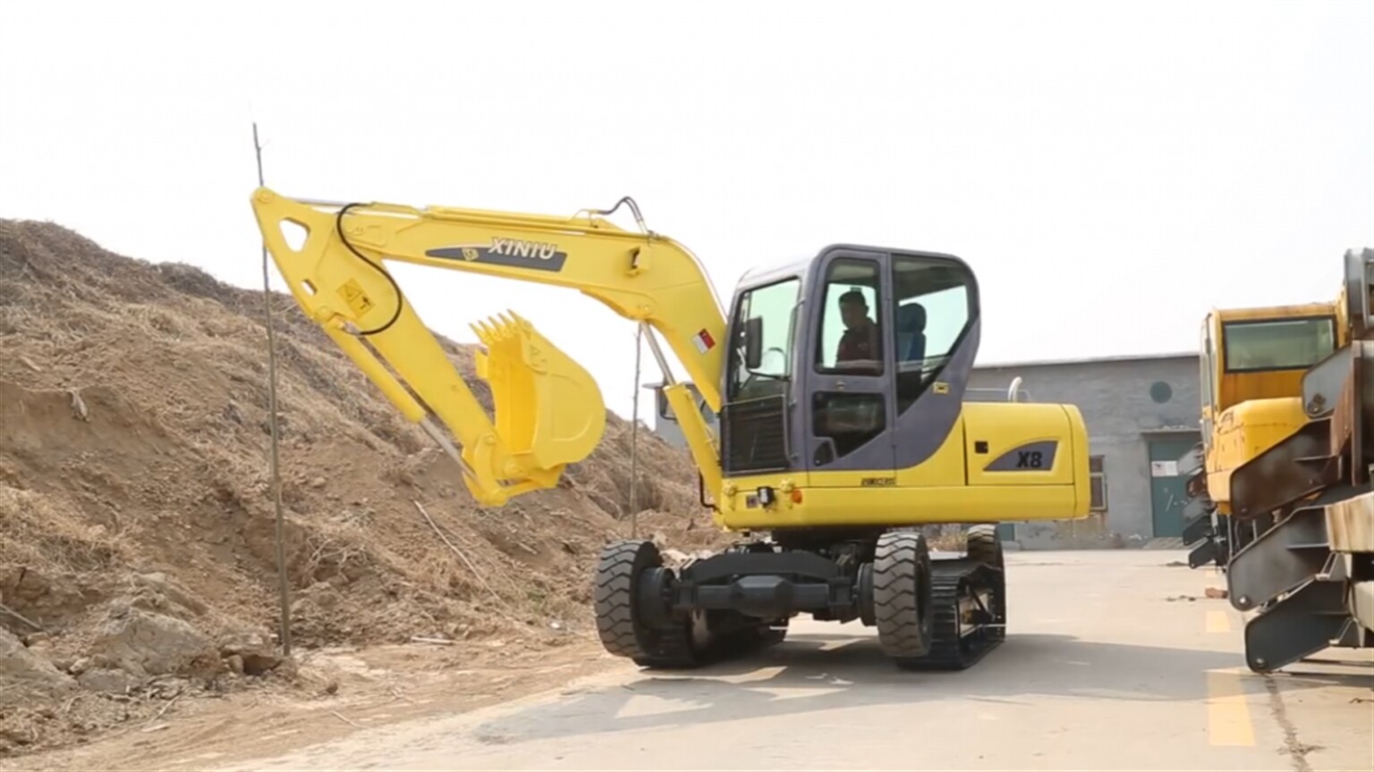 Is it a wheelie on tracks, or a tracked excavator on wheels?