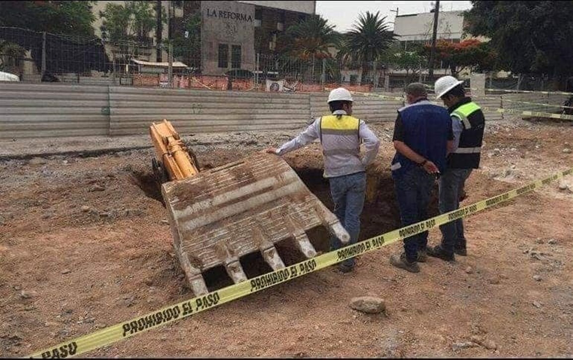 Excavator consumed by sinkhole!