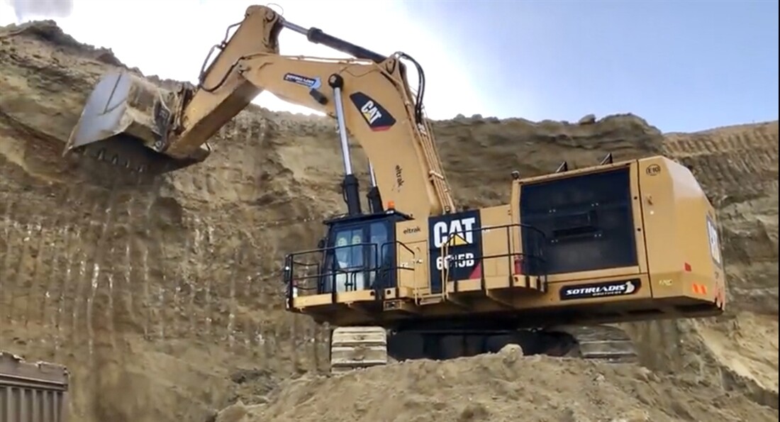 Big Cat Loads Trucks in Two Passes