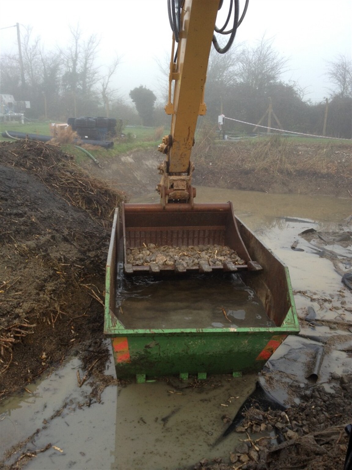 Excavator mounted stone washing & screening attachments