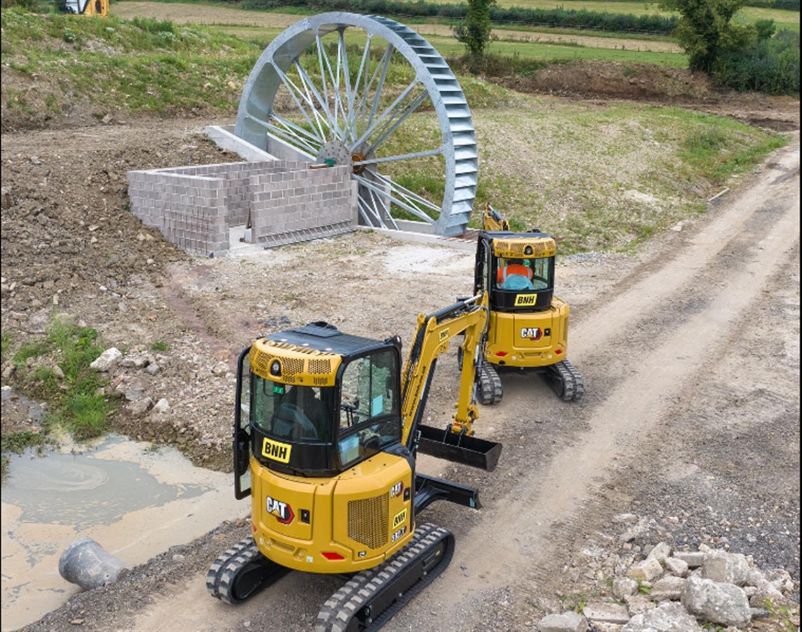 Cats install electric producing water wheel