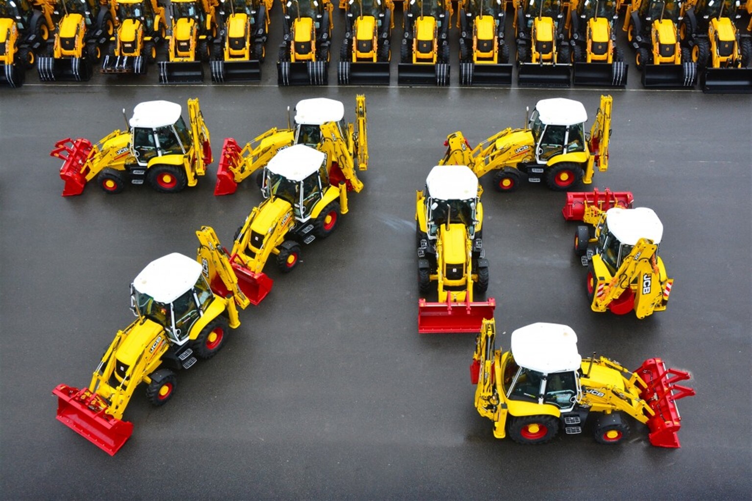 Tri-colour 70th anniversary JCB's roll off the production line
